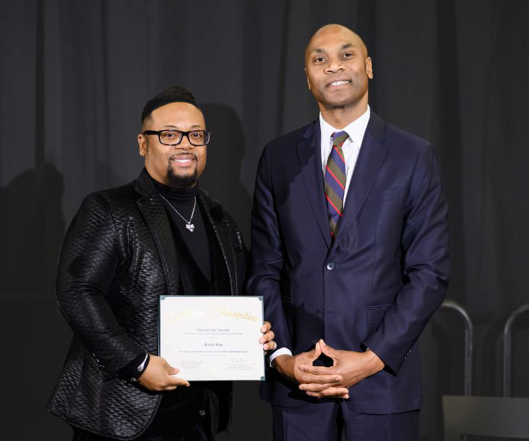 Dr. Kent Key holds award from Excellence in Diversity, Equity and Inclusion Awards Ceremony